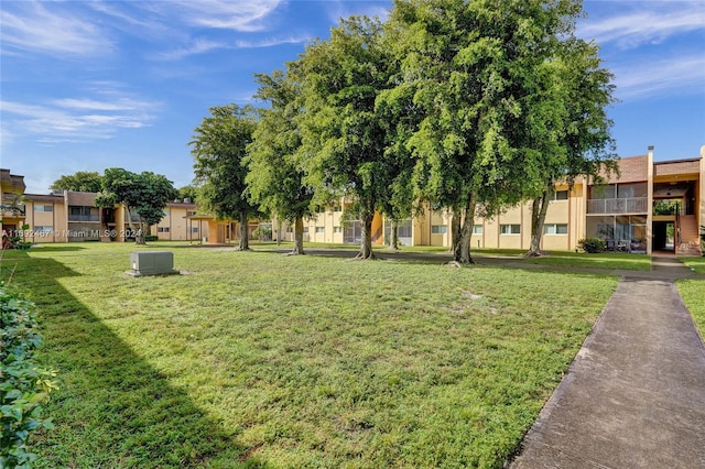 view of community featuring a yard