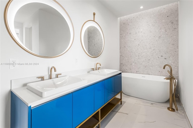 bathroom featuring vanity and a bathing tub