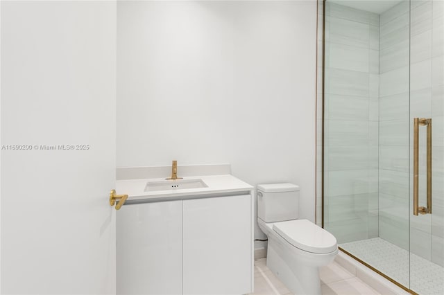 bathroom featuring vanity, tile patterned floors, toilet, and a stall shower