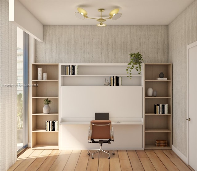 home office featuring wallpapered walls and wood finished floors