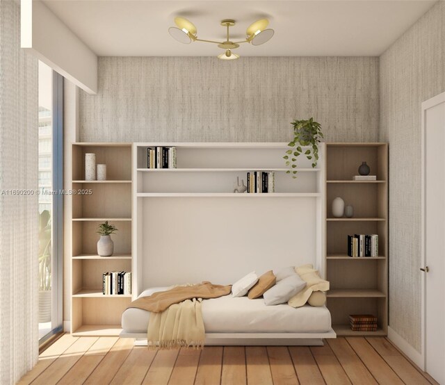 sitting room with hardwood / wood-style flooring