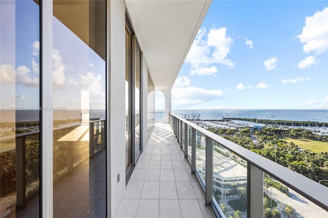 balcony featuring a water view