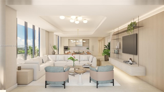 living room with a raised ceiling and a notable chandelier