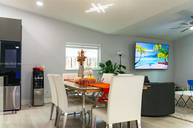 dining area with light hardwood / wood-style flooring and ceiling fan