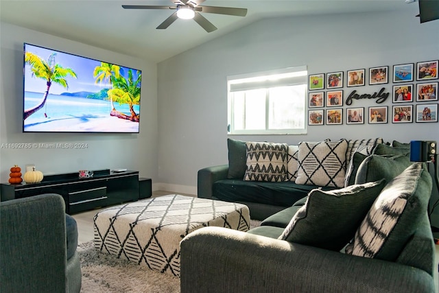 living room featuring ceiling fan and vaulted ceiling