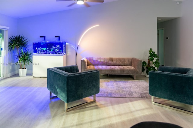 living room with hardwood / wood-style floors and ceiling fan