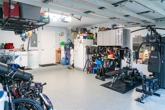 garage with electric panel, a garage door opener, and white refrigerator with ice dispenser