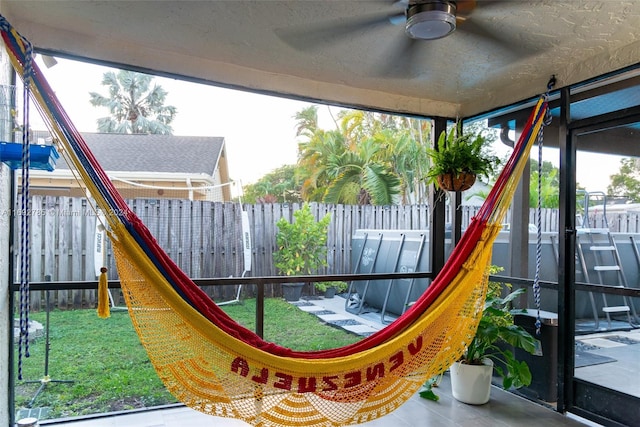 view of playground featuring ceiling fan and a yard