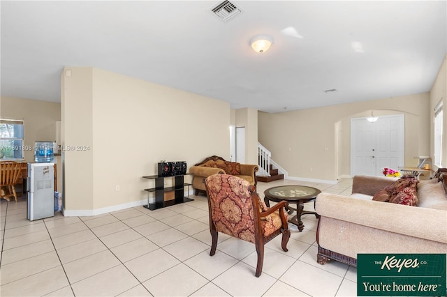 living room with plenty of natural light and light tile patterned flooring