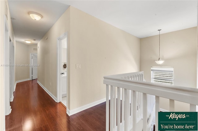 hallway featuring dark hardwood / wood-style flooring