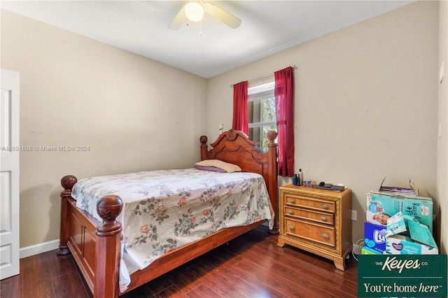 bedroom with dark hardwood / wood-style floors and ceiling fan