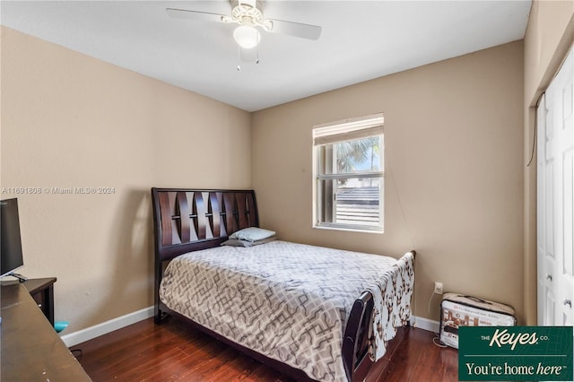 bedroom featuring dark hardwood / wood-style floors, a closet, and ceiling fan