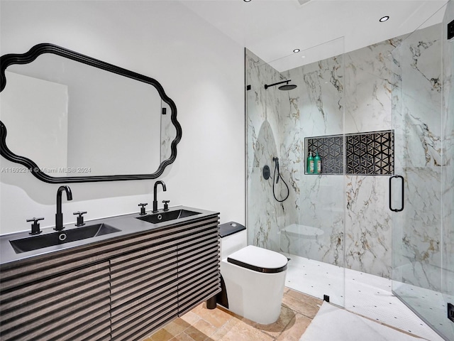 bathroom with vanity, an enclosed shower, and toilet