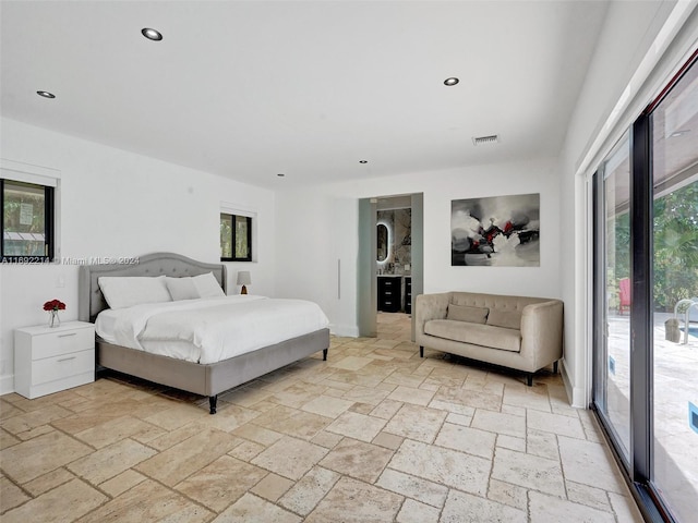 bedroom featuring multiple windows and access to exterior