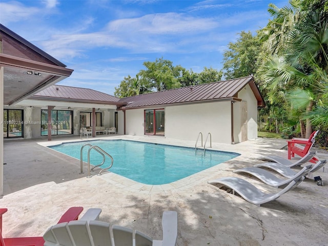 view of pool featuring a patio