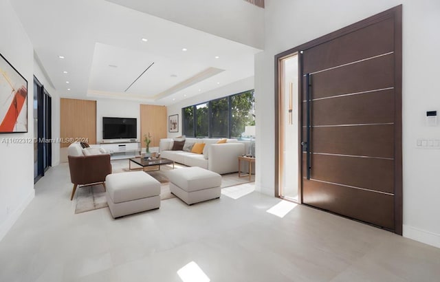 living room with a tray ceiling