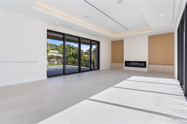 living room featuring a raised ceiling