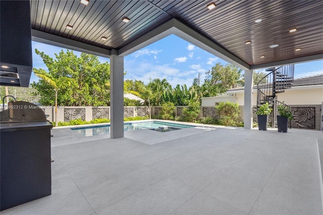 view of patio with a fenced in pool