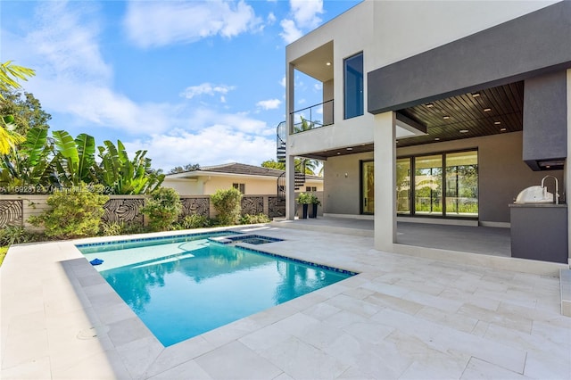 view of pool featuring area for grilling and a patio