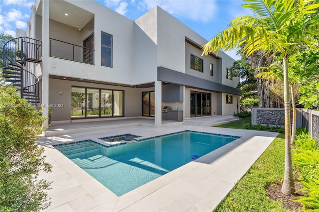 view of pool featuring an in ground hot tub and a patio area