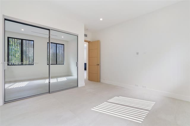 unfurnished bedroom featuring a closet