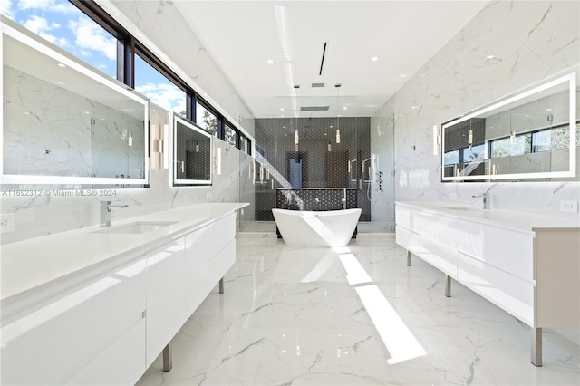 bathroom featuring vanity, plus walk in shower, and tile walls