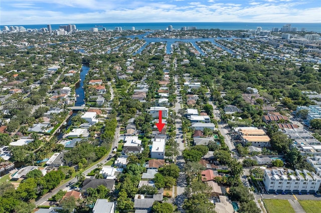 birds eye view of property with a water view