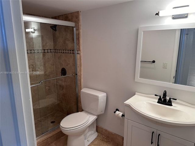 bathroom featuring walk in shower, vanity, and toilet