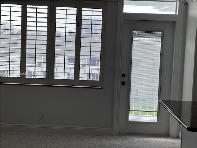 entryway featuring carpet floors