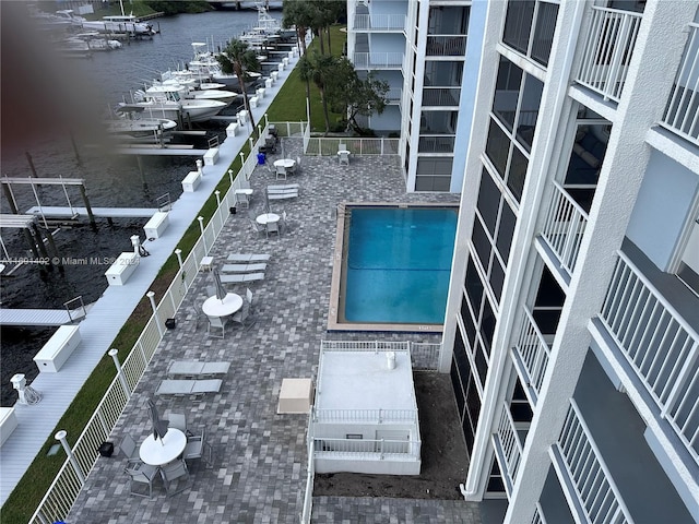 view of swimming pool with a water view