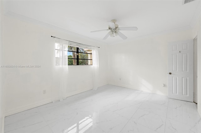 empty room with ornamental molding and ceiling fan