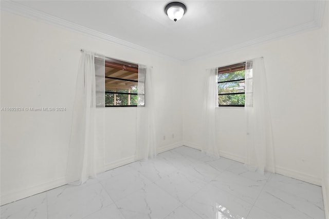 empty room with a healthy amount of sunlight and crown molding