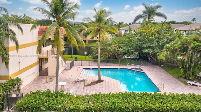 view of swimming pool with a patio area