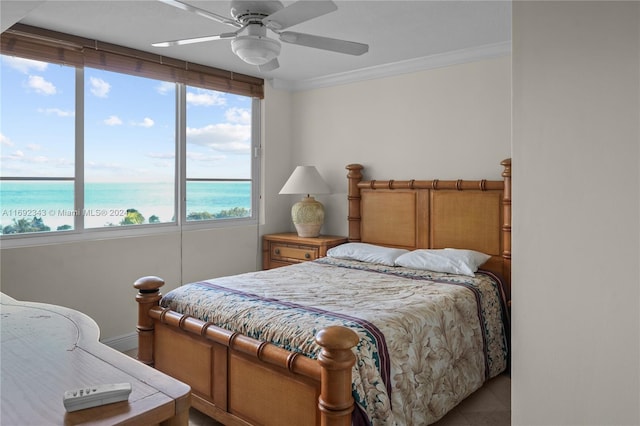 tiled bedroom featuring ceiling fan, a water view, and ornamental molding