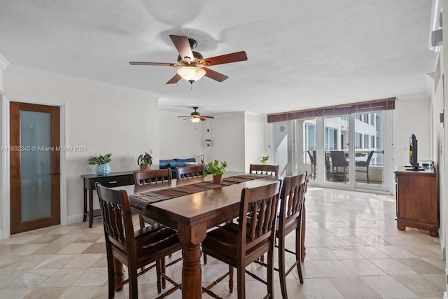 dining area with crown molding and a textured ceiling