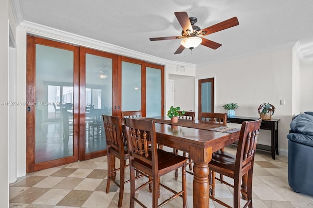 dining room featuring ornamental molding, french doors, and a textured ceiling