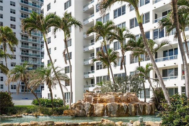 5005 Collins Ave Unit 615, Miami Beach, FL 33140 - view of apartment building / complex featuring a garden pond