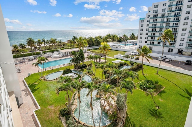 birds eye view of property with a water view