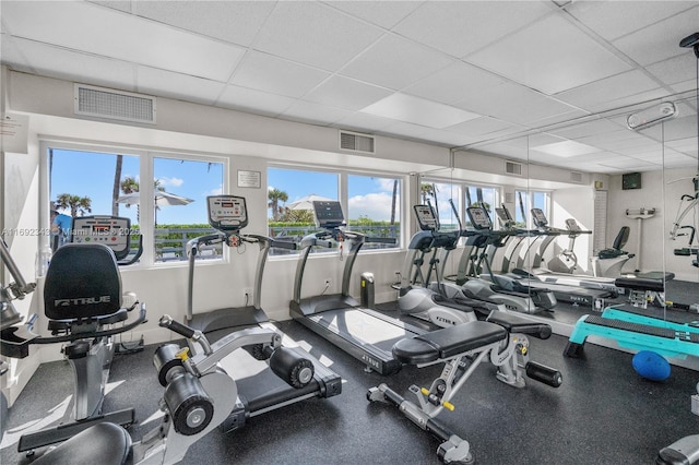 gym featuring a drop ceiling