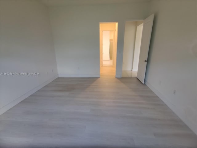 spare room with light hardwood / wood-style flooring