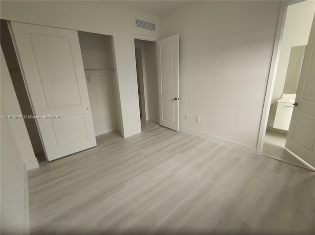 unfurnished bedroom with light hardwood / wood-style flooring