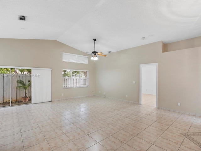 unfurnished room with light tile patterned floors, high vaulted ceiling, and ceiling fan