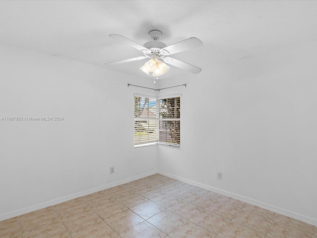 spare room featuring ceiling fan