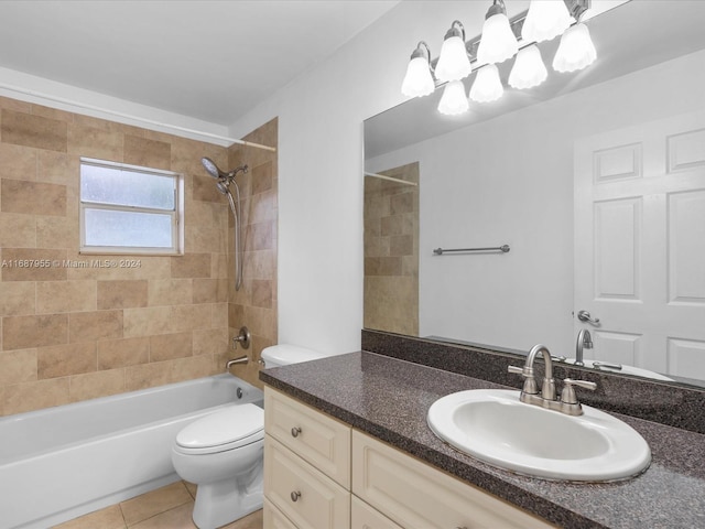 full bathroom with tile patterned flooring, tiled shower / bath combo, toilet, and vanity