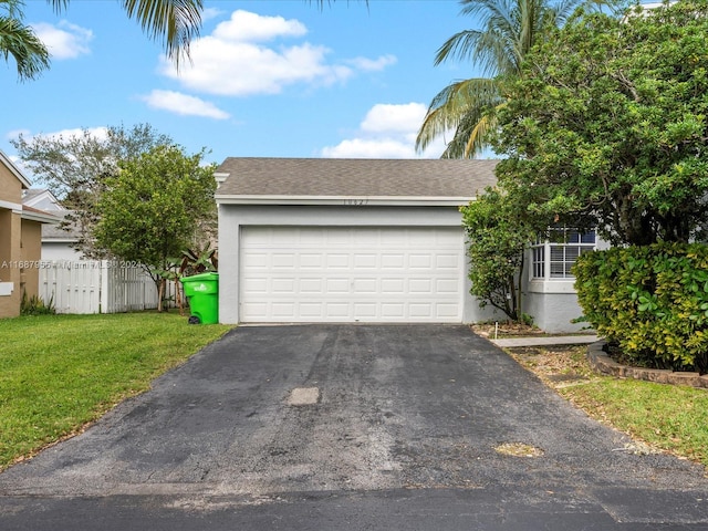 garage featuring a lawn