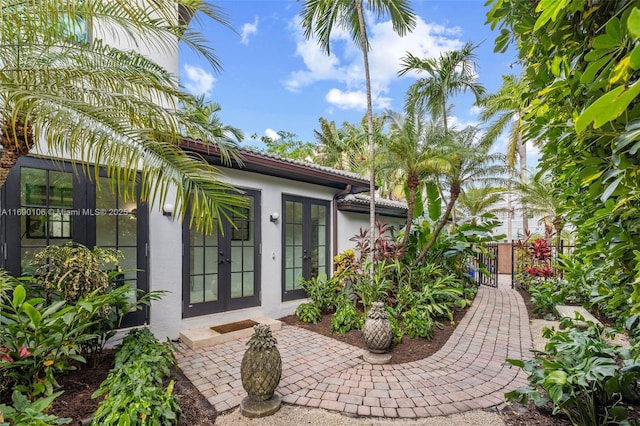 entrance to property featuring french doors