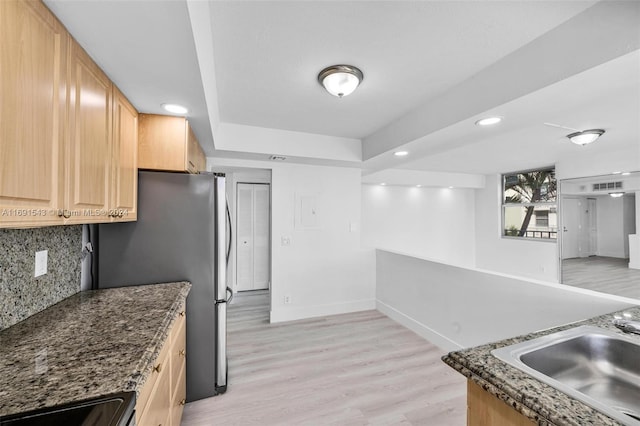 16570 NE 26th Ave Unit 2A, North Miami Beach, FL 33160 - kitchen featuring tasteful backsplash, a sink, light wood finished floors, freestanding refrigerator, and recessed lighting