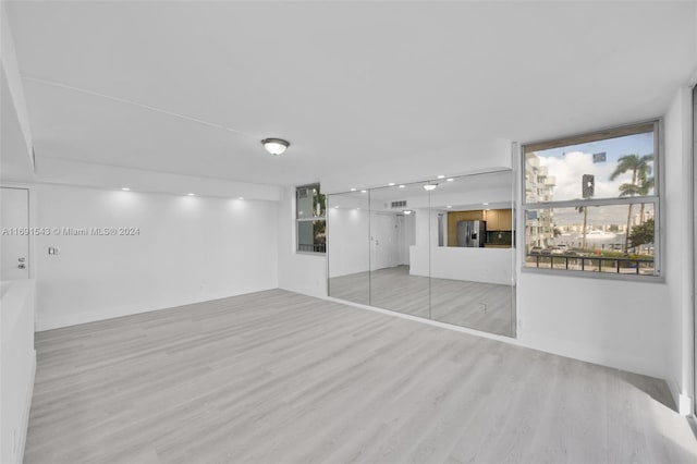 16570 NE 26th Ave Unit 2A, North Miami Beach, FL 33160 - spare room featuring light wood finished floors