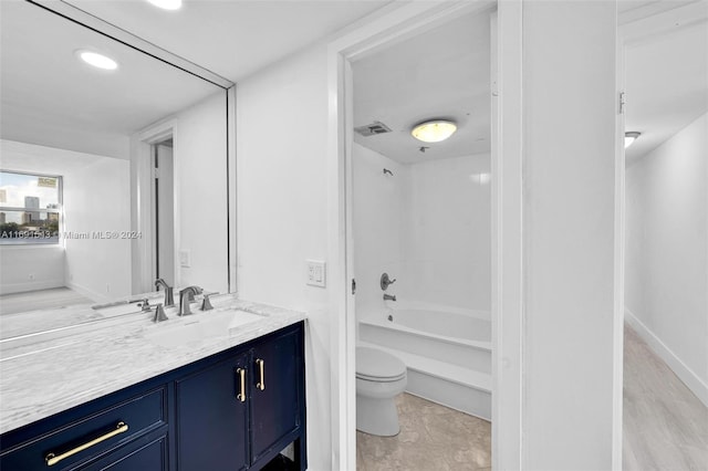 16570 NE 26th Ave Unit 2A, North Miami Beach, FL 33160 - bathroom featuring toilet, vanity, bathing tub / shower combination, baseboards, and recessed lighting