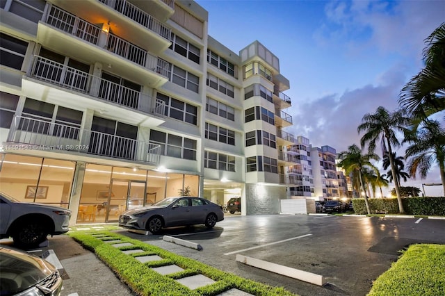 16570 NE 26th Ave Unit 2A, North Miami Beach, FL 33160 - view of apartment building / complex with uncovered parking